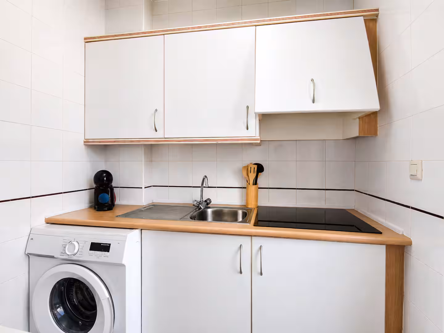 Open kitchen in wood and white tones