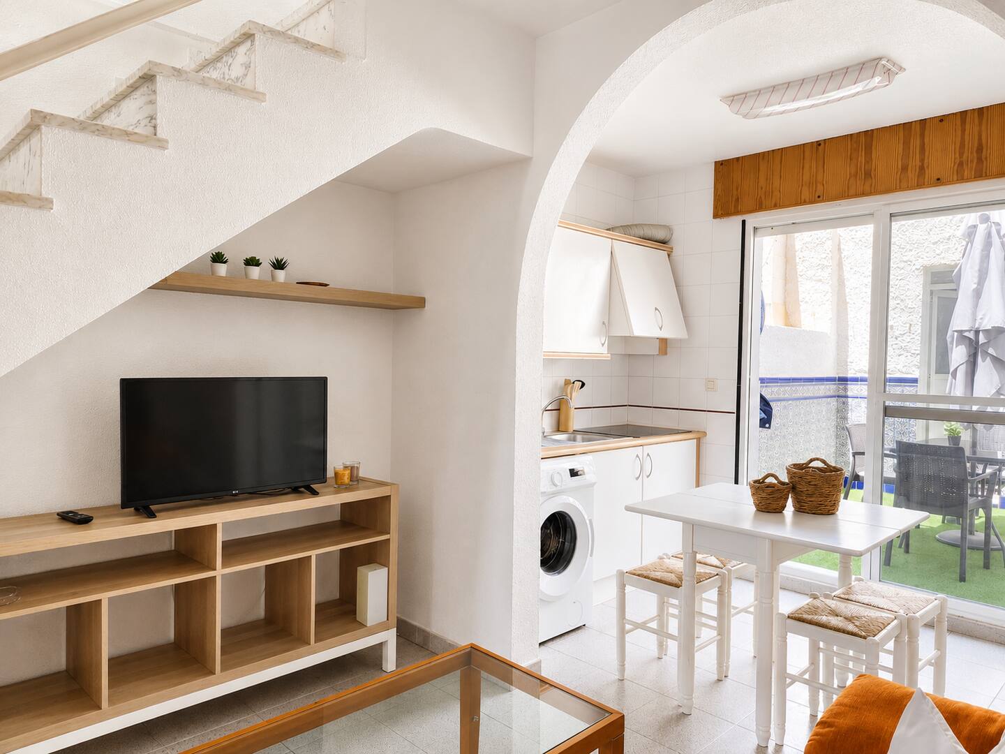 Open kitchen in wood and white tones